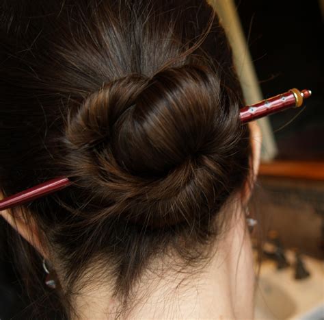 chopstick in hair|pulling back hair with chopsticks.